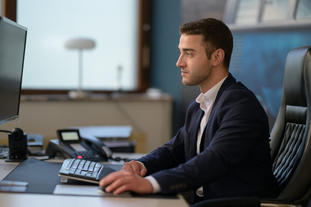 Business executive working at a desk in a modern office in Germany